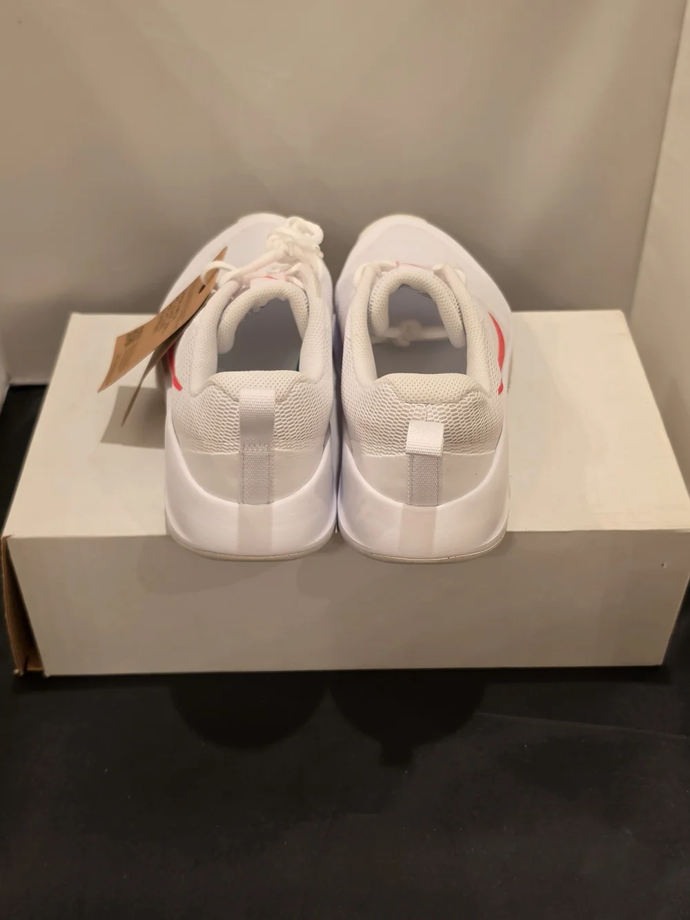 Nike Women's White Athletic Sneakers with Pink Swoosh